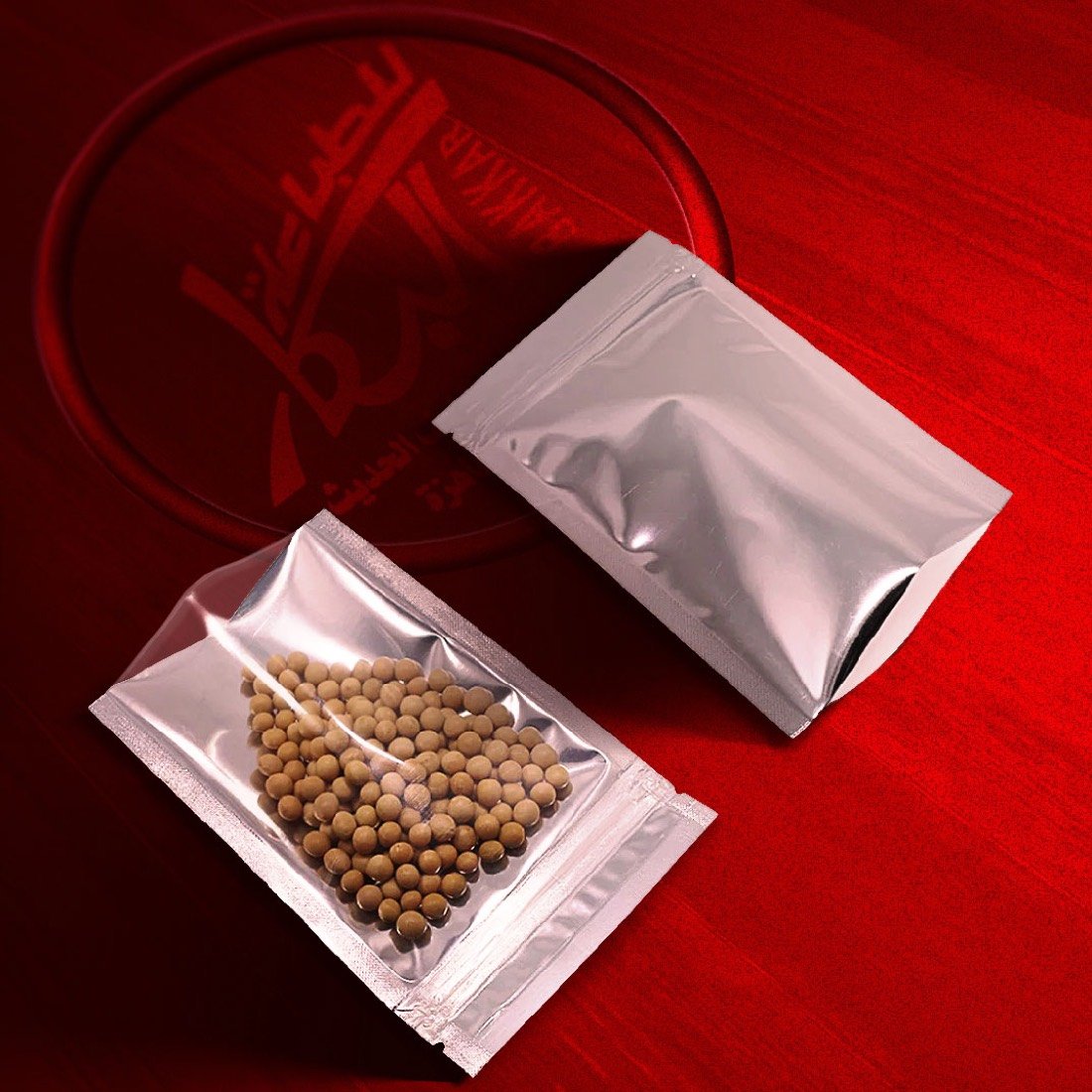 Two silver aluminium three-side-seal pouches, one open and one filled with chickpeas.